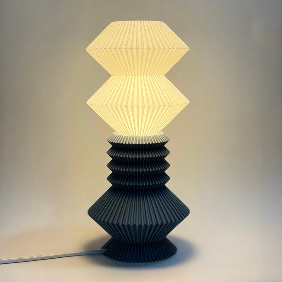 Table lamp with geometric design on a plain background